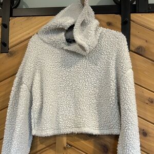 Women’s crop sweater with hood.